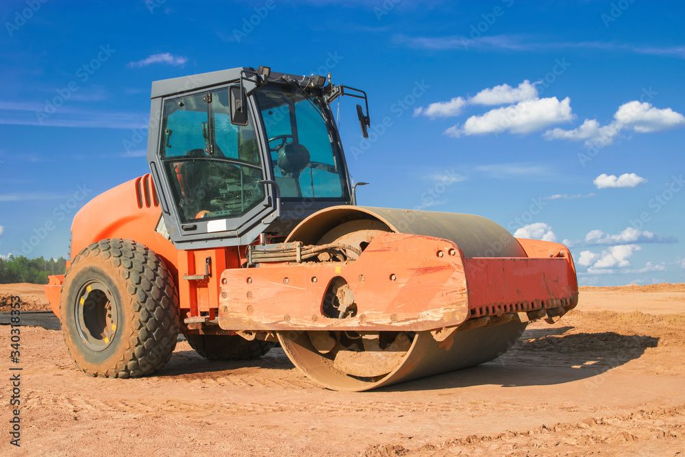 soil compactor against the sky on the sand soil compactor against the sky on the sand