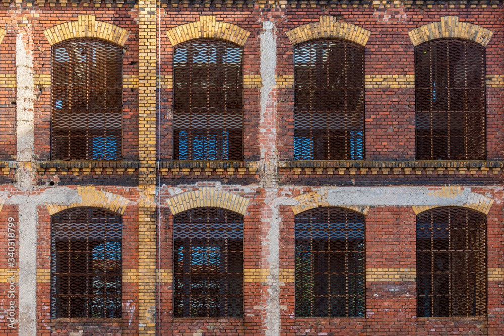 Fototapeta premium Old dutch brick facade with red and beige clinker partly decayed