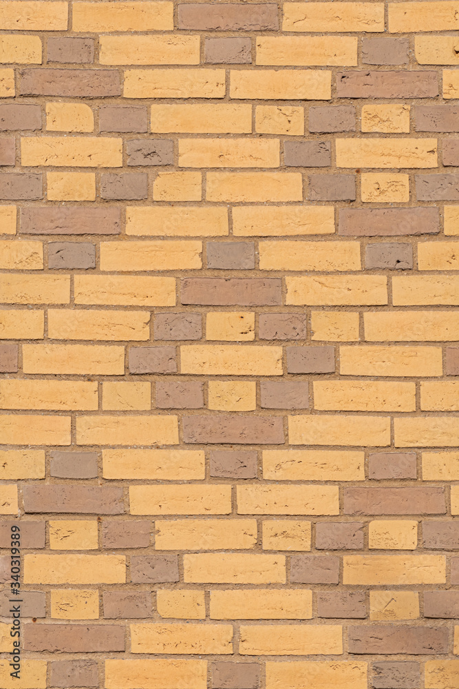 Texture of beige and brown dutch brick facade with diamond pattern Texture of beige and brown dutch brick facade with diamond pattern