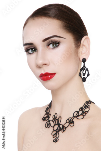 Young woman in fancy necklace