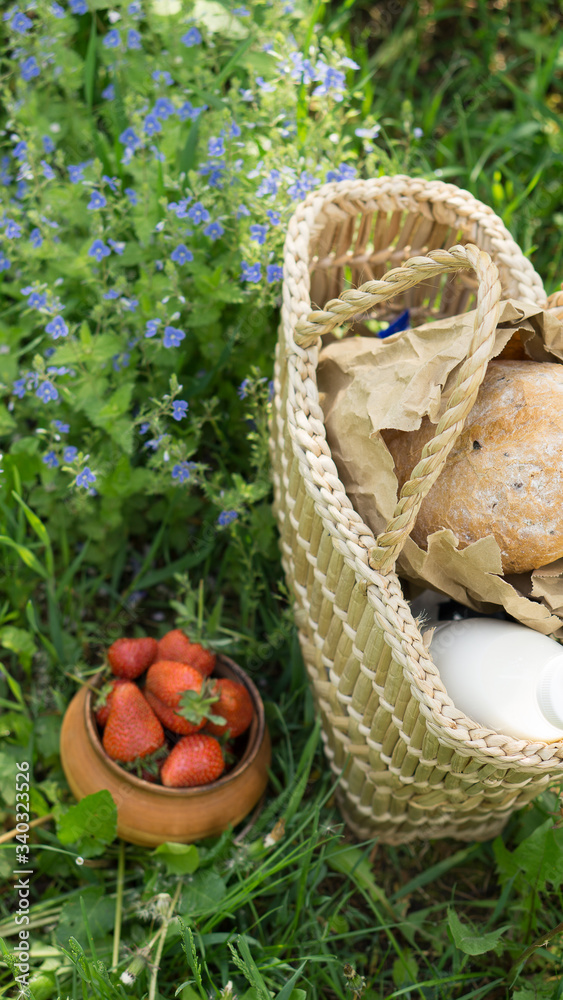 basket with bread and milk