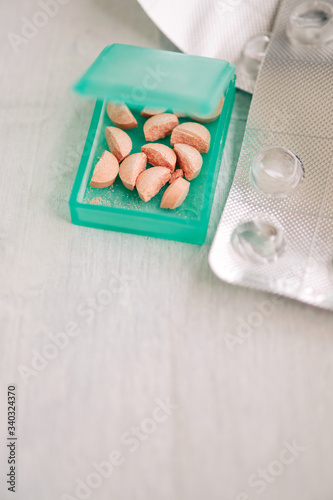 Pillbox with cut pills to take daily dose