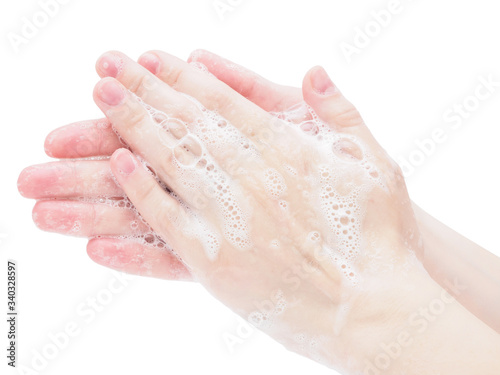 Hand washing during the coronavirus pandemic on a white background, close-up. Step-by-step instructions for washing hands with soap, virus protection. Taking precautions and preventing colds