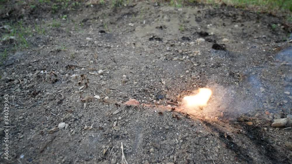 Gunpowder igniting and burning down. exlposives detonating on the ground. sulfur exhalation and explosion Gunpowder igniting and burning down. exlposives detonating on the ground. sulfur exhalation and explosion