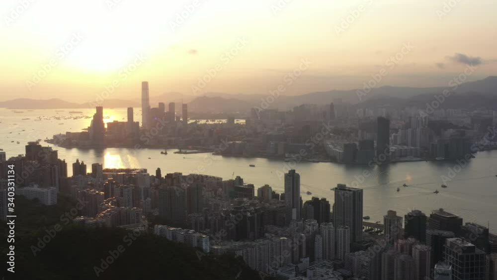 Aerial View Sunrise of the Hong Kong City Skyline and sunflares 4K stock video. Aerial View Sunrise of the Hong Kong City Skyline and sunflares 4K stock video.
