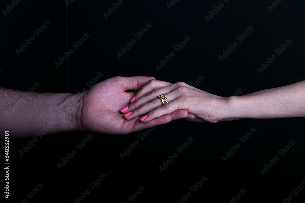 A view of man and women holding hands