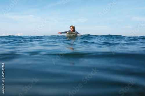 Surf In Water. Surfing Man On Surfboard. © puhhha