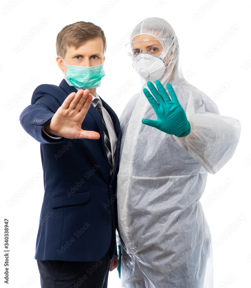 A man in a business suit and a medic show with a hand gesture to stop the epidemic. viruses and global financial problems due to a pandemic. Isolated on a white background. A man in a business suit and a medic show with a hand gesture to stop the epidemic. viruses and global financial problems due to a pandemic. Isolated on a white background.