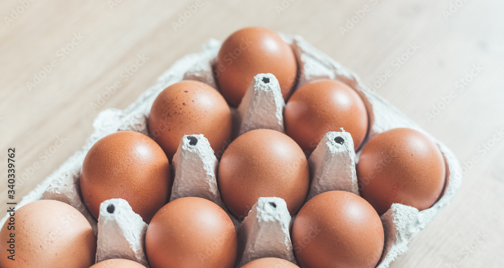 Eggs in a basket for morning breakfast or baking a cake, top view. Eggs in a basket for morning breakfast or baking a cake, top view.