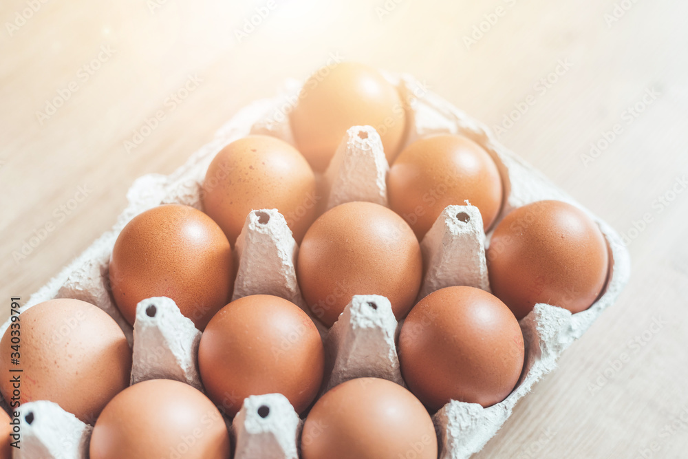 Eggs in a basket for morning breakfast or baking a cake, top view. Eggs in a basket for morning breakfast or baking a cake, top view.