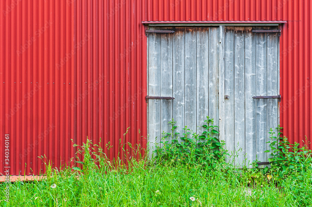 Wooden door on red barn Wooden door on red barn