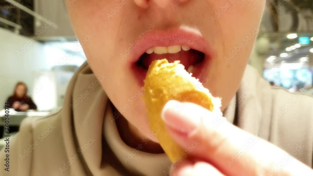 woman eating soup in a fast food restaurant woman eating soup in a fast food restaurant