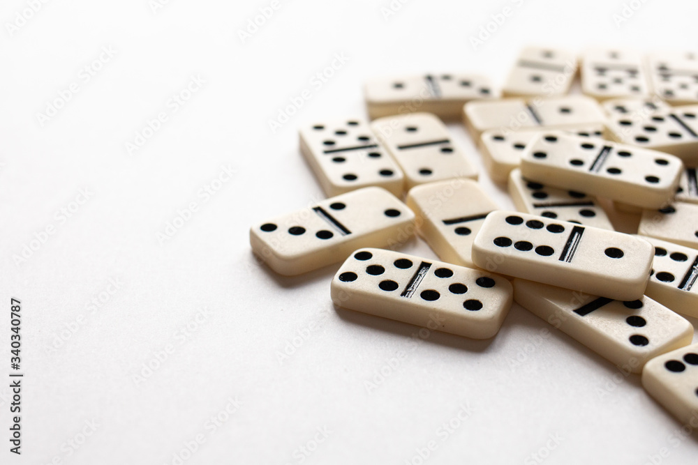 Ivory dominoes in a pile with a white background. Ivory dominoes in a pile with a white background.
