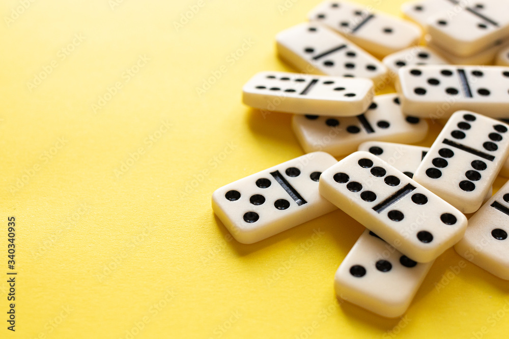 domino pieces on the yellow background domino pieces on the yellow background