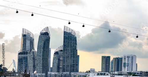 Harbour Front buldings and bay with cable cars and large ships, Singapore, March 30, 2020