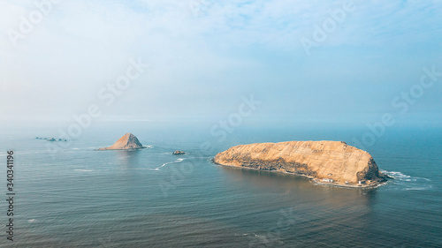 Aerial view of the Pacific Ocean and the great islands from the Temple of the Sun in Pachacamac, Lima, Peru.
 photo