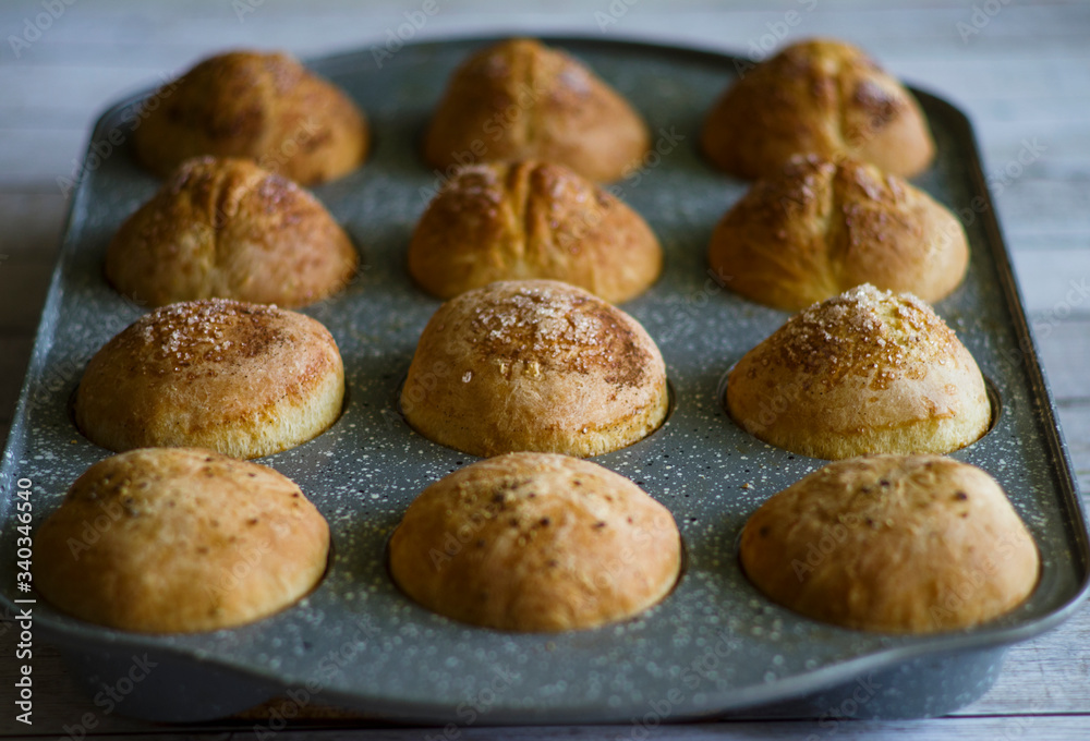 Homemade baking . Buns laid on a baking sheet Homemade baking . Buns laid on a baking sheet