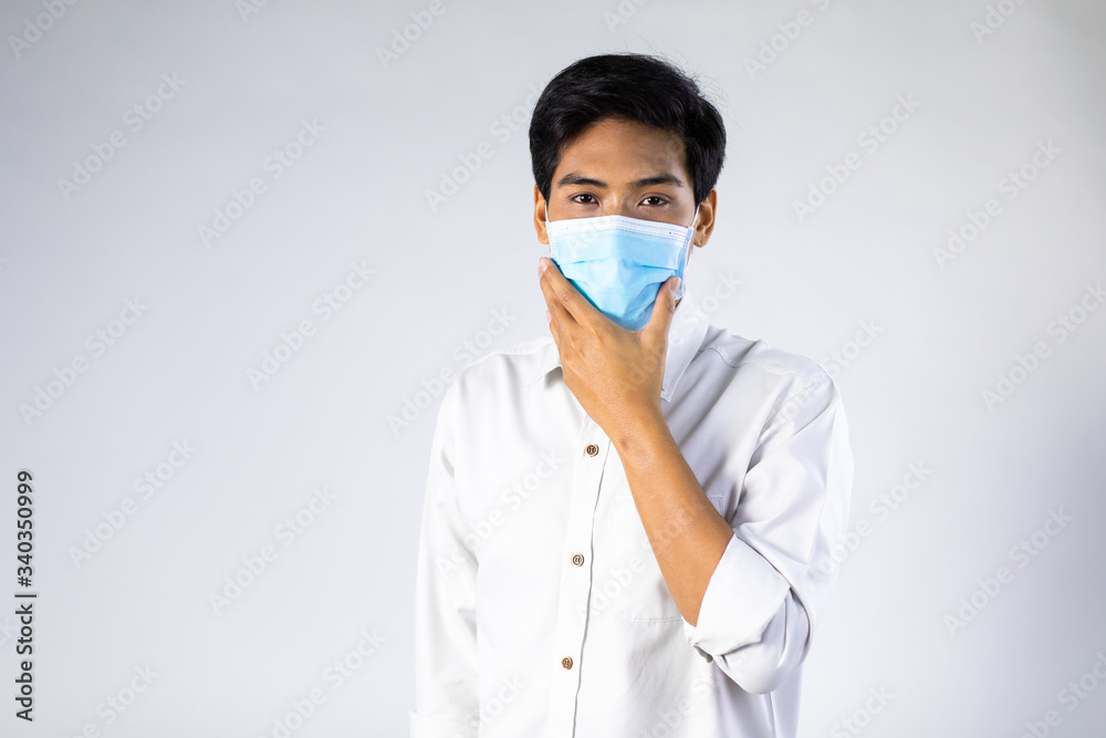 Studio portrait of Asian woman wearing face medical surgical mask, looking at camera, isolated on white background. Mask protection against virus. Covid-19, coronavirus pandemic Studio portrait of Asian woman wearing face medical surgical mask, looking at camera, isolated on white background. Mask protection against virus. Covid-19, coronavirus pandemic