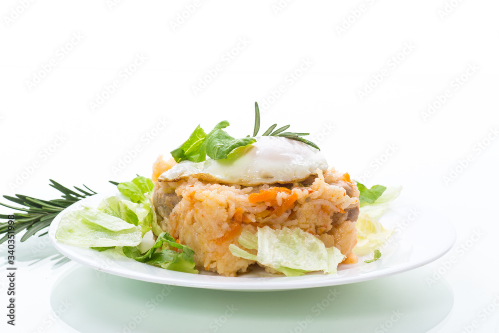 boiled rice with vegetables and fried egg with salad leaves in a plate boiled rice with vegetables and fried egg with salad leaves in a plate