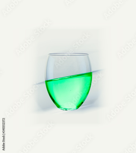 Isolated glass with green liquid
