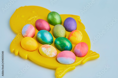 Easter eggs on a blue background, light Easter holiday
