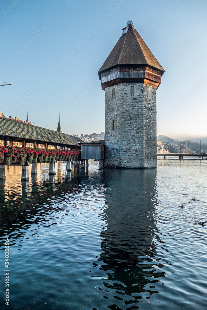 the Chapel Bridge in Lucerne reflected in the water