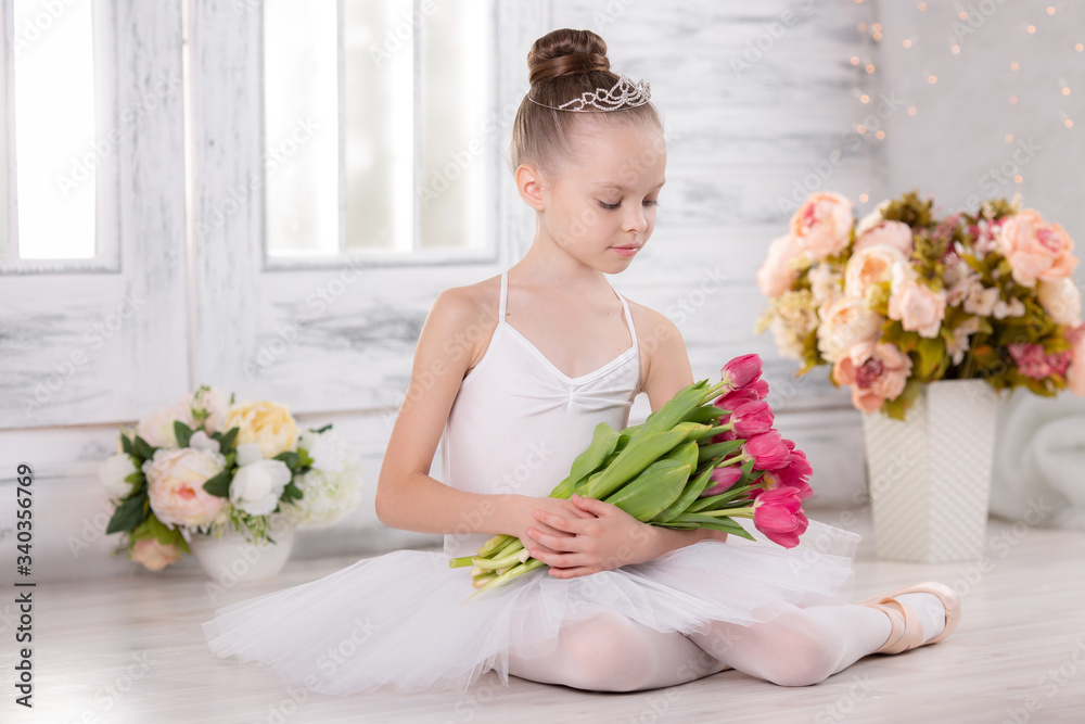beautiful girl with a bouquet of pink tulips. ballerina beautiful girl with a bouquet of pink tulips. ballerina