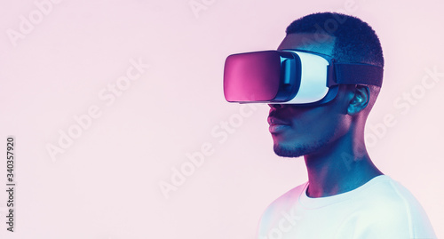 Obraz na plátne Web banner of young african man wearing virtual reality headset