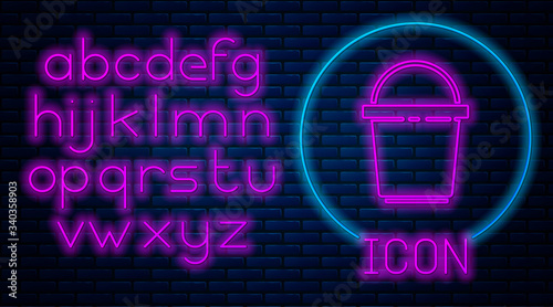 Glowing neon Bucket icon isolated on brick wall background. Cleaning service concept. Neon light alphabet. Vector Illustration