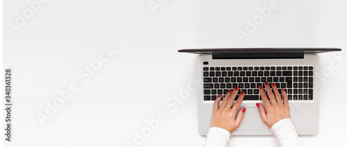 Banner of girl hands in a laptop. Business workspace with blank clean copy space, flat lay, above view