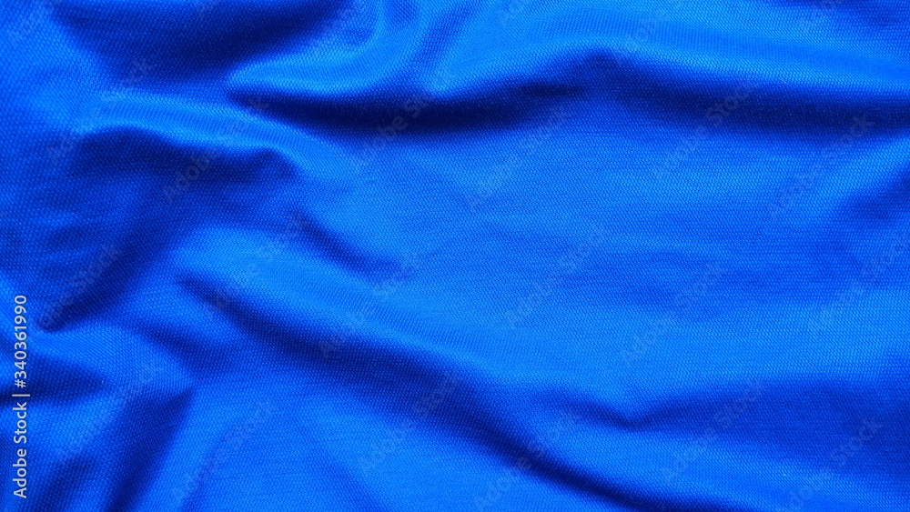 Top view of dark and bright blue crumpled fabric with texture and motion for beautiful background and decoration. Top view of dark and bright blue crumpled fabric with texture and motion for beautiful background and decoration.
