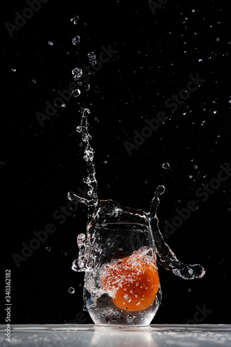 tomato water splash in a drinking glass