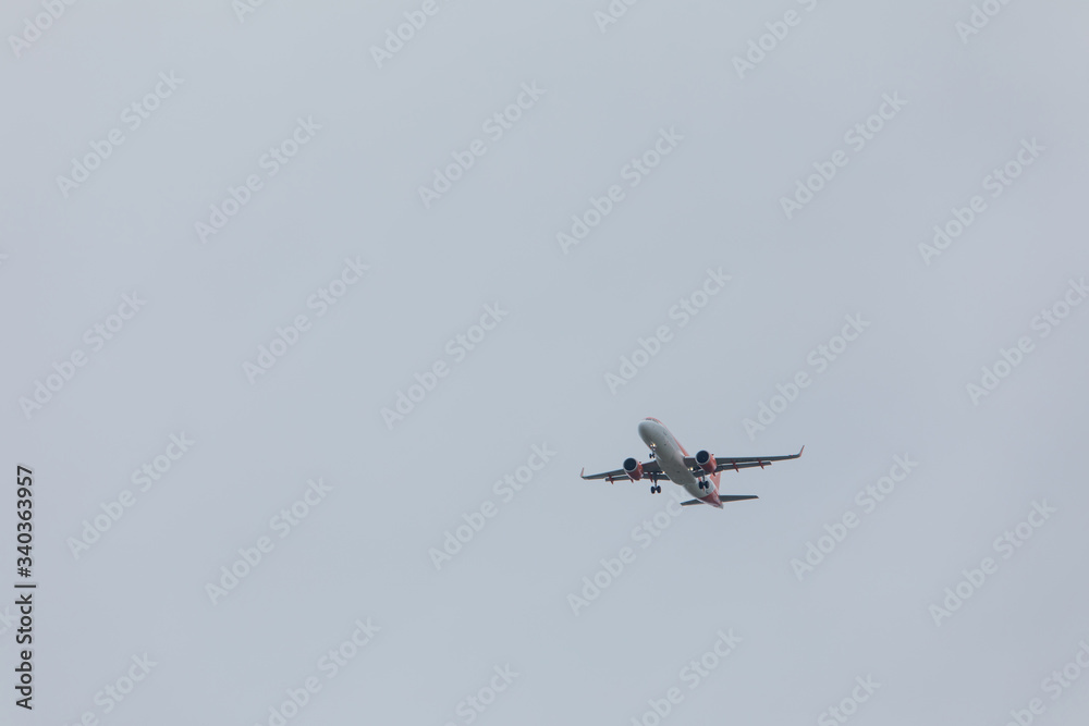 plane in sky landing overcast weather plane in sky landing overcast weather