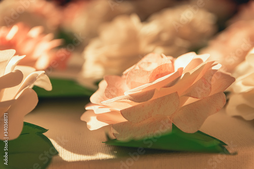 tinkered roses made of paper in selective focus