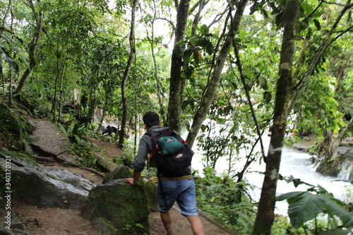 a man hiking in the Peruvian rainforest