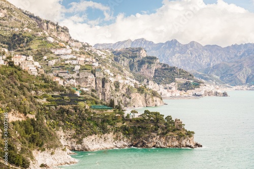 Fototapeta Naklejka Na Ścianę i Meble -  High angle shot of the beautiful buildings by the Amalfi Coast captured in Italy