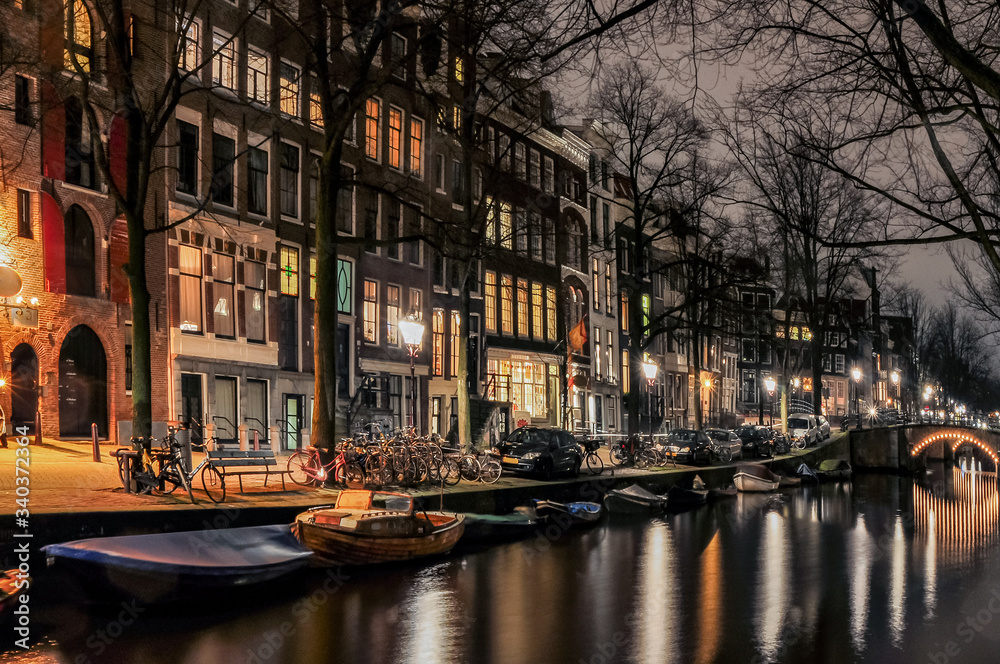 Canals of Amsterdam in night illumination