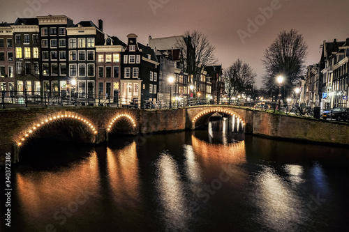 Canals of Amsterdam in night illumination