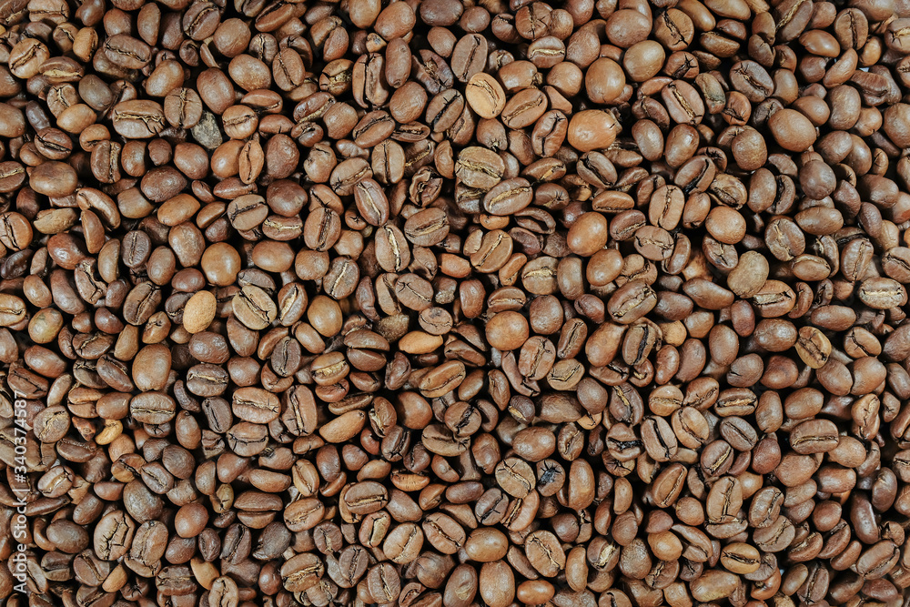 Roasted coffee beans, background, coffee texture. Top view. Roasted coffee beans, background, coffee texture. Top view.
