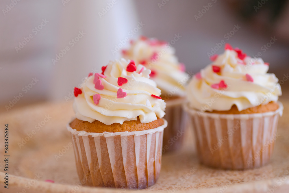 cupcake with pink hearts eatable decor close up