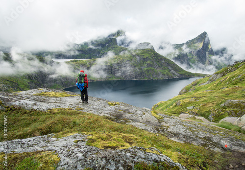 foggy mountains on Lofoten with hiker