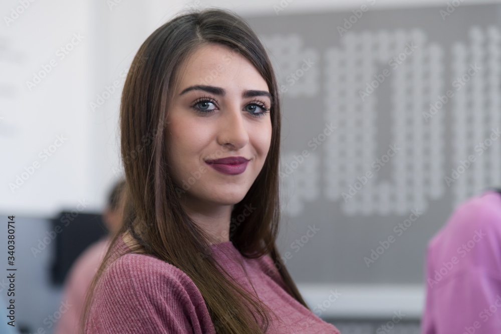Side view of students using computer in lab. IT student looking and ...