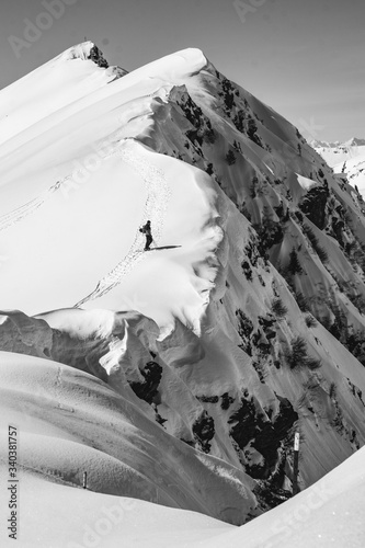 skier on the edge of a ridge