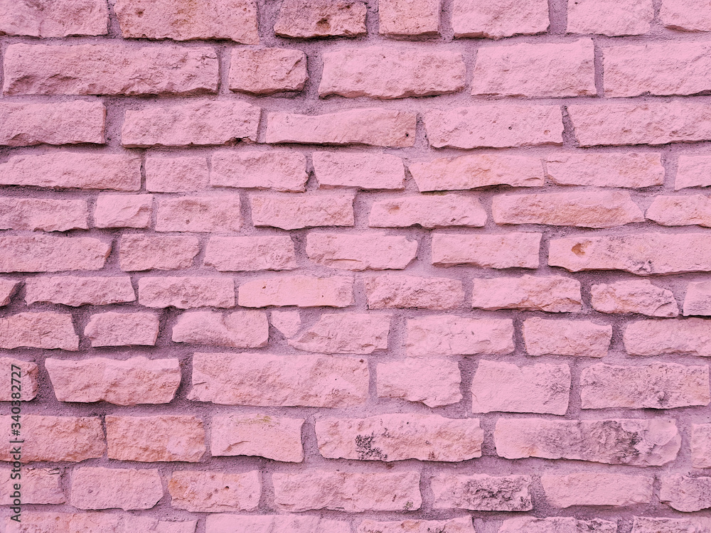 Light pink brick old stone wall texture background.