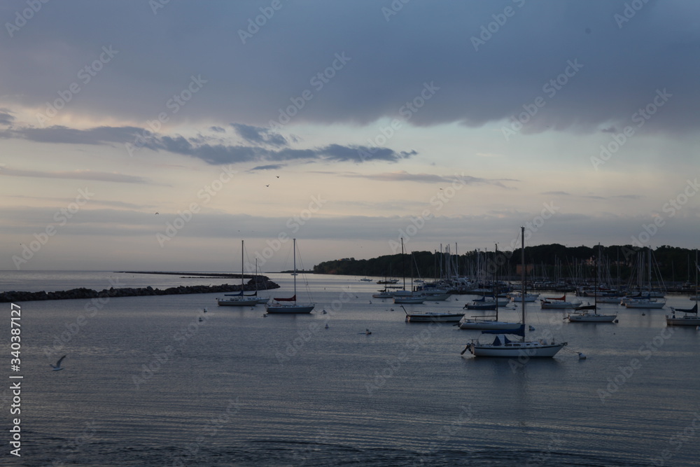 SUNSET ON THE LAKE WITH A BOAT MARINA, SAILBOATS, BLUE WATER, RELAXING SUNSET ON THE LAKE WITH A BOAT MARINA, SAILBOATS, BLUE WATER, RELAXING