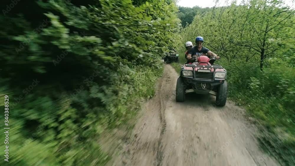 Cheerful company on vacation ..video of young people riding ATVs . Four-wheel ATV transport and extreme sport.little fun.ATVs.Quad Bikes. Cheerful company on vacation ..video of young people riding ATVs . Four-wheel ATV transport and extreme sport.little fun.ATVs.Quad Bikes.