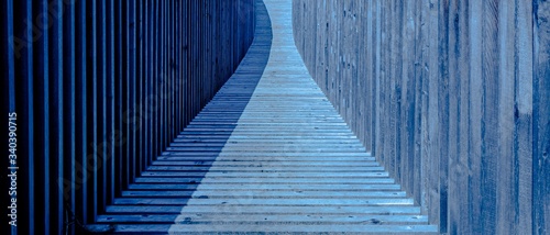 Amazing view of a blue wooden footbridge under sunlight photo