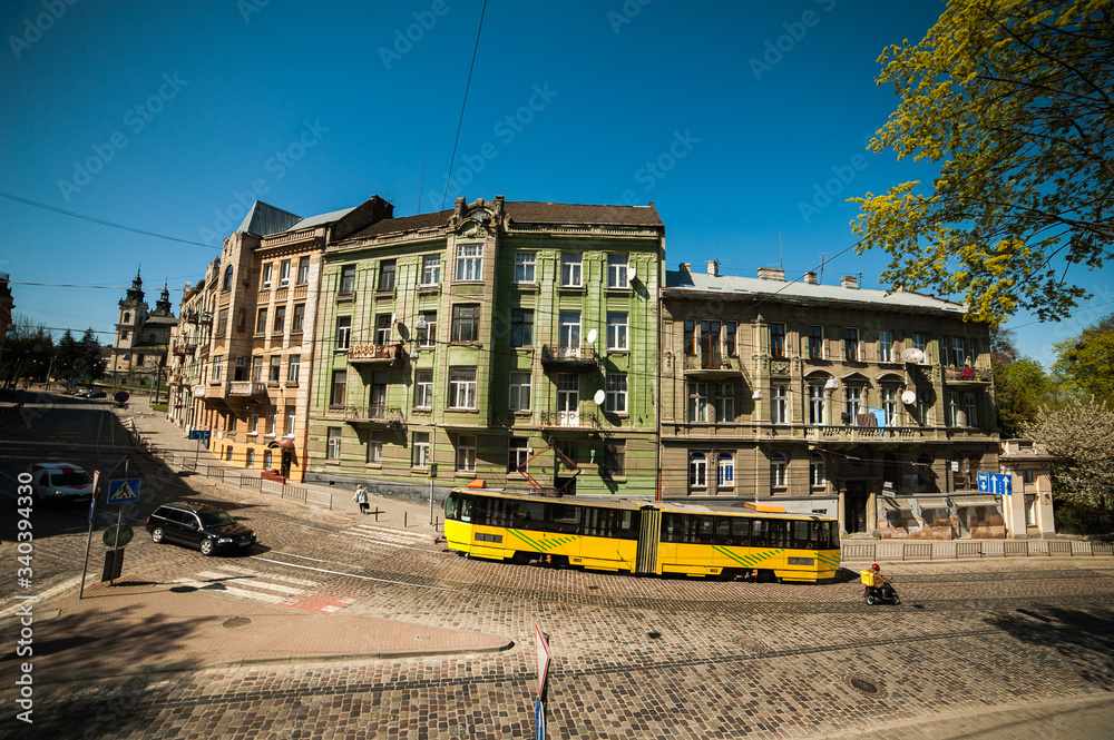 A tram rides through the old town