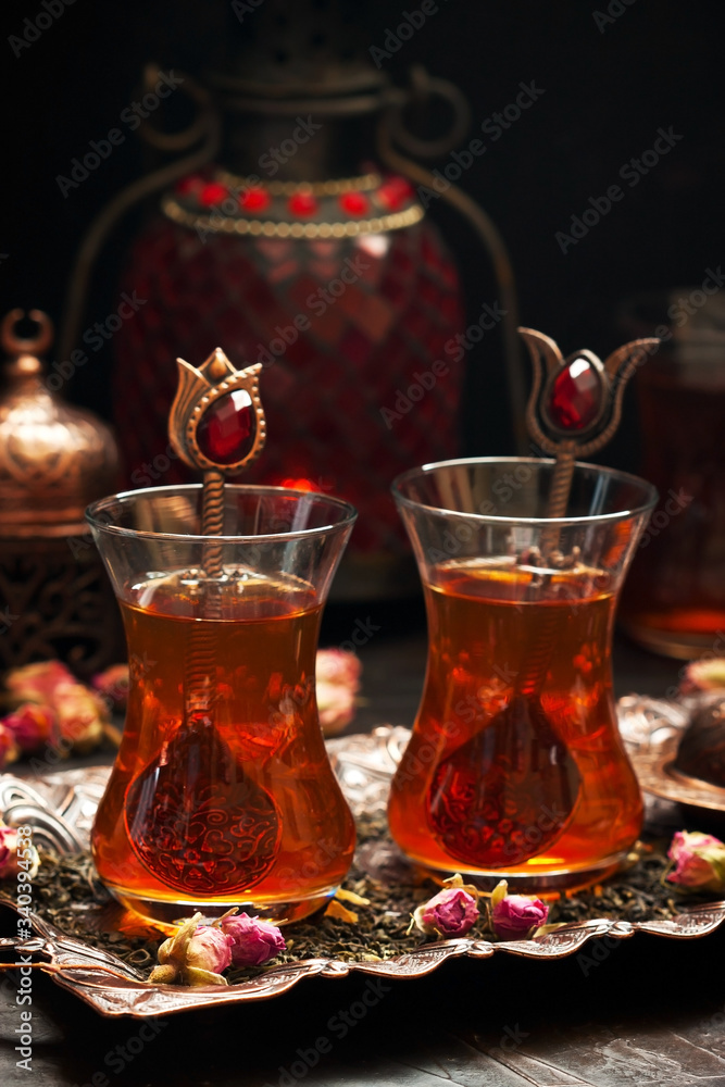 Traditionally served Turkish tea on copper tray Traditionally served Turkish tea on copper tray