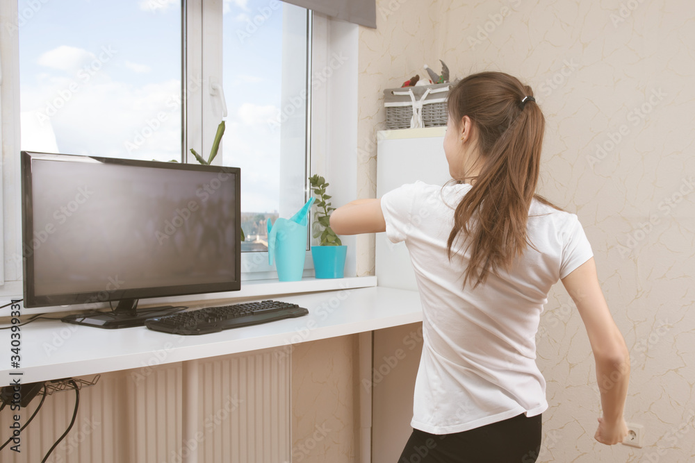 Dance classes during quarantine. Girl does online exercises by video calling Dance classes during quarantine. Girl does online exercises by video calling